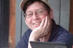This photo was taken during the 2013-14 academic year when Cash was selected as the Jack Sareault Award recipient, honoring the Northwest Conference’s Sports Information Director of the Year. He also received the award in 2008-09.